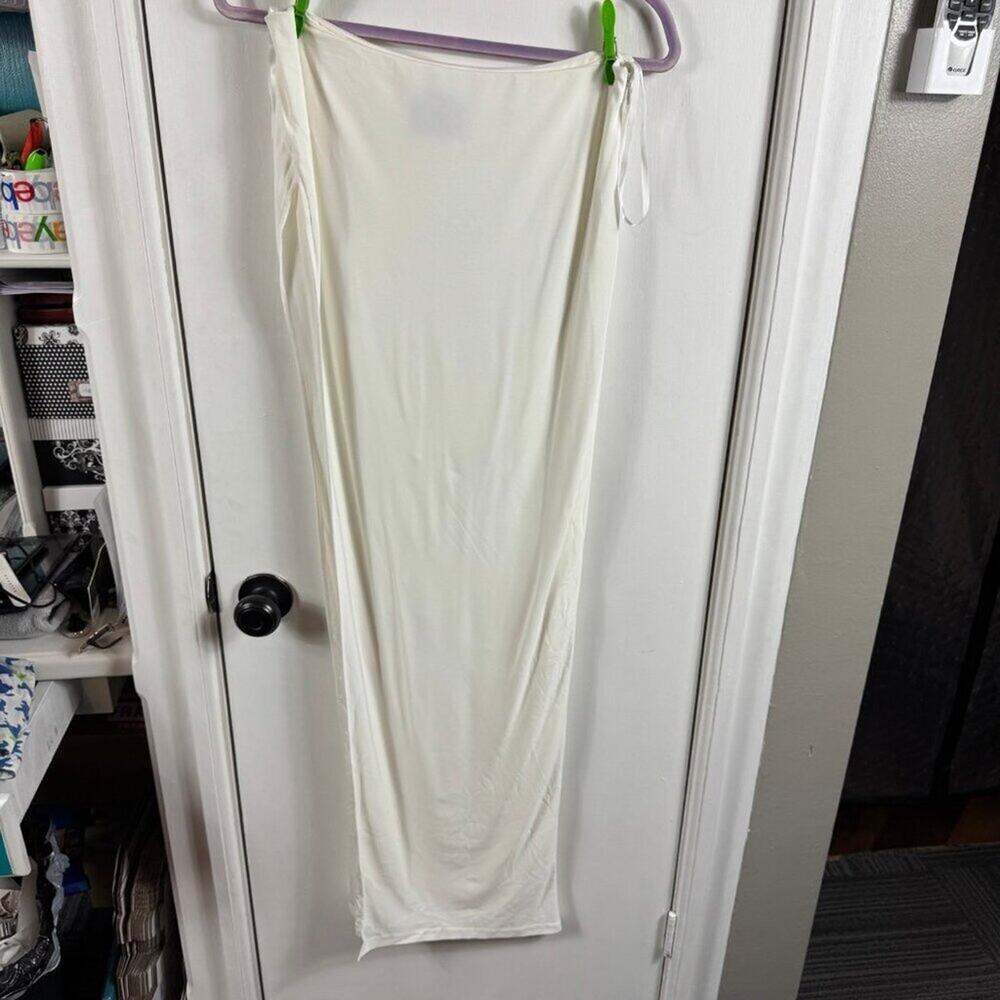 Abyss by Abby white maxi skirt with high slit.